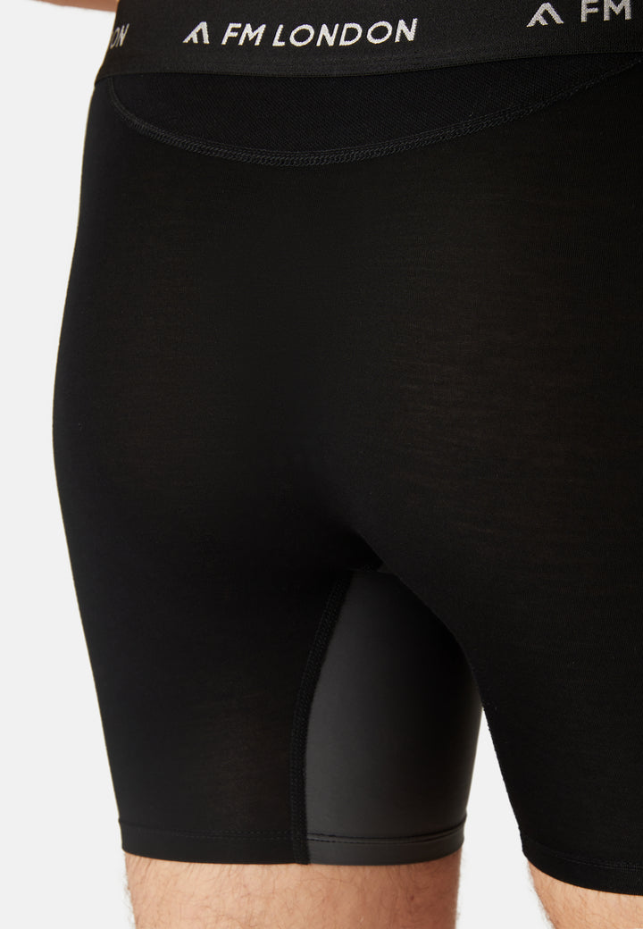 Black athletic shorts with 'AFM London' branding on a white background